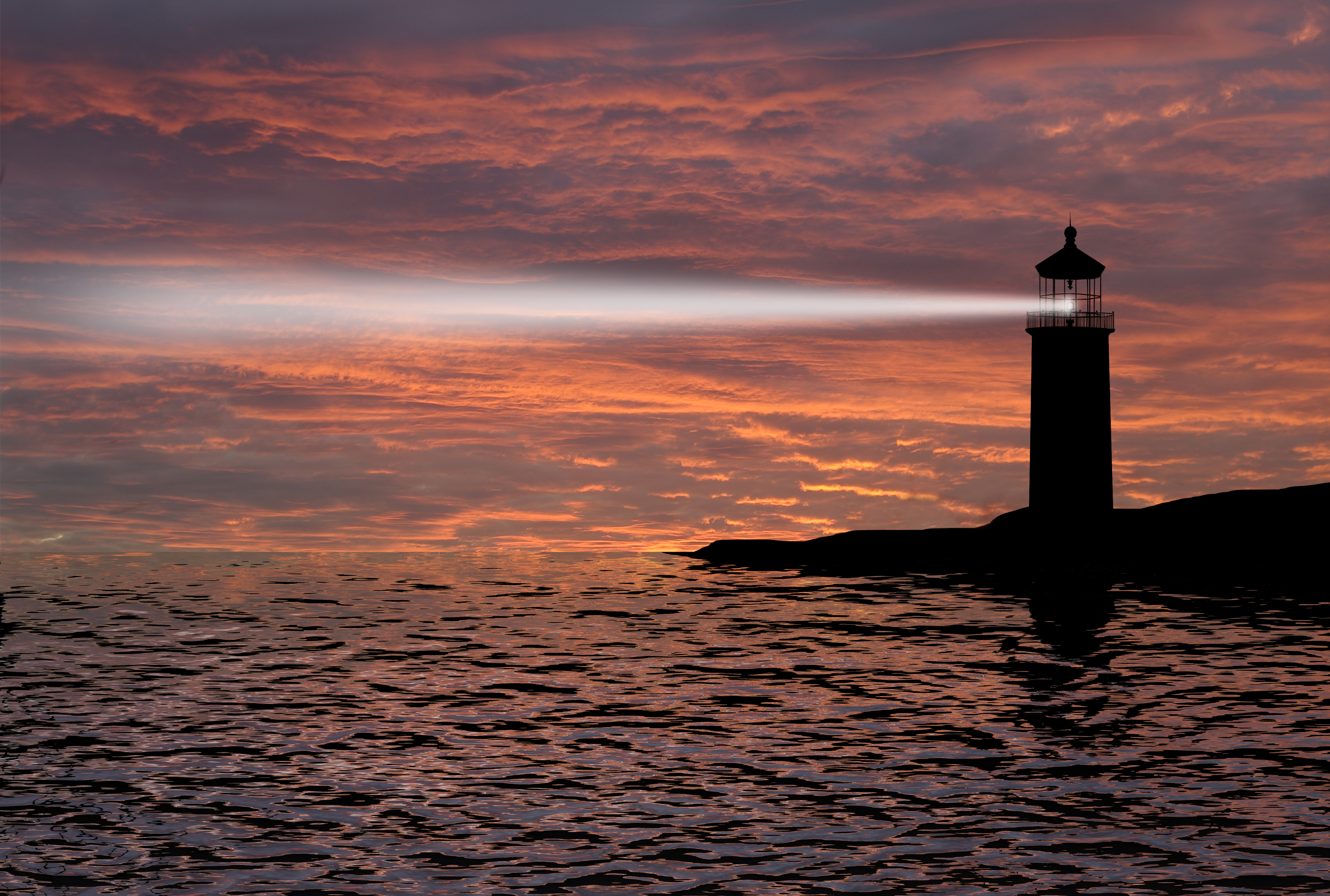 Lighthouse searchlight beam through marine air at night.